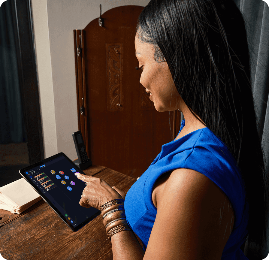 Woman using SpotOn tablet for restaurant reservations