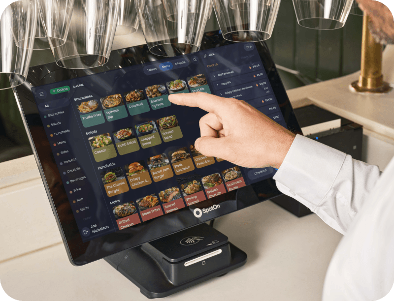 Server using SpotOn POS on Station 15 in a casual dining restaurant